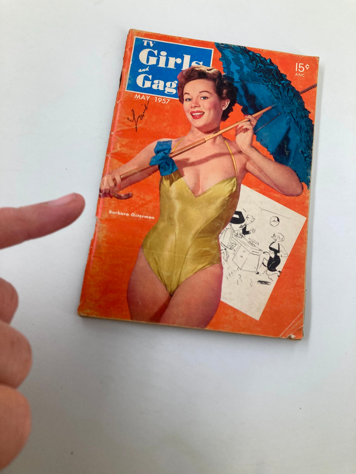 VTG TV Girls and Gags Magazine May 1957 cover with Barbara Osterman displaying a yellow swimsuit and blue umbrella, showing minor wear.