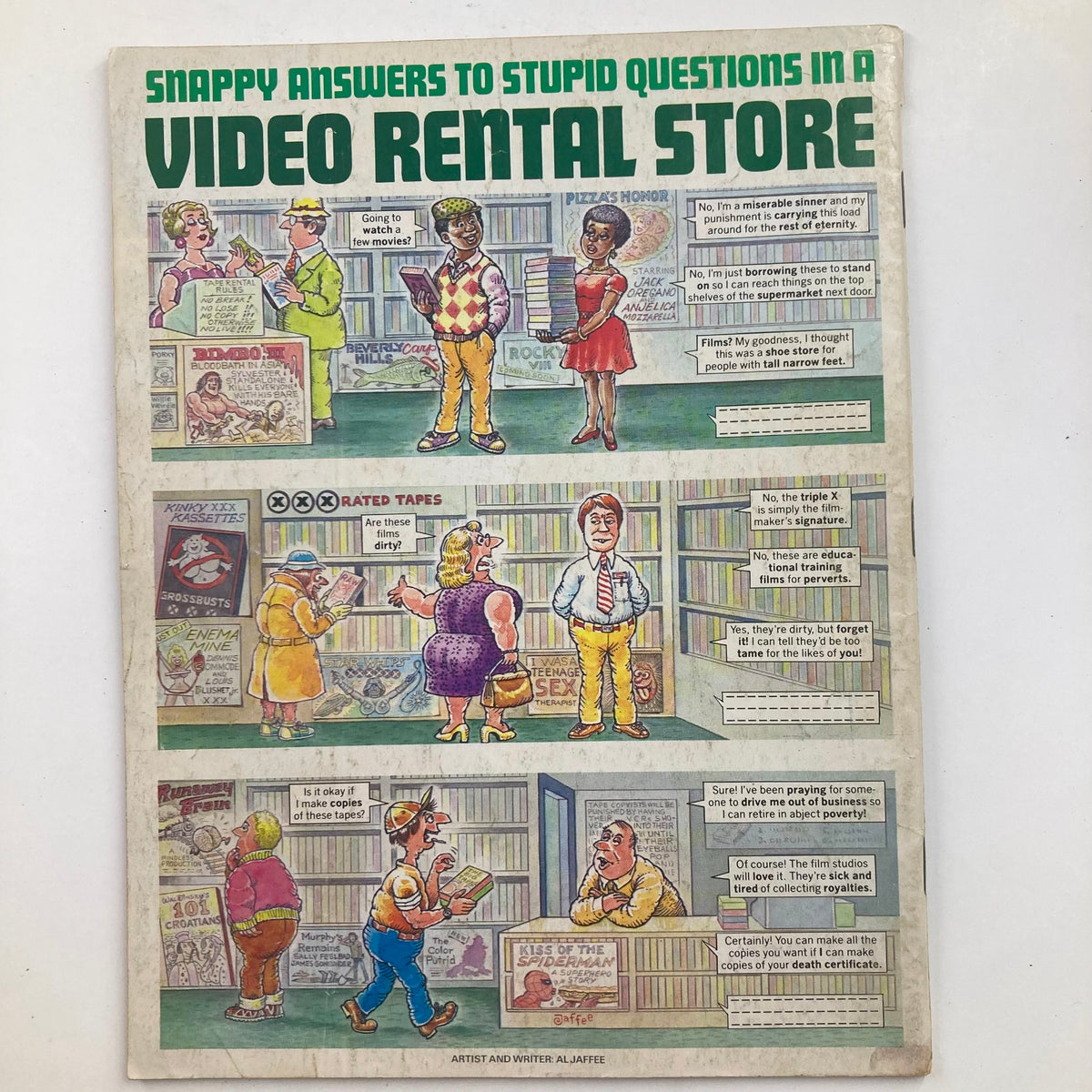 Back cover of Mad Magazine July 1986 No. 264 with a comic strip titled 'Snappy Answers to Stupid Questions in a Video Rental Store,' emphasizing the humor style of the publication.