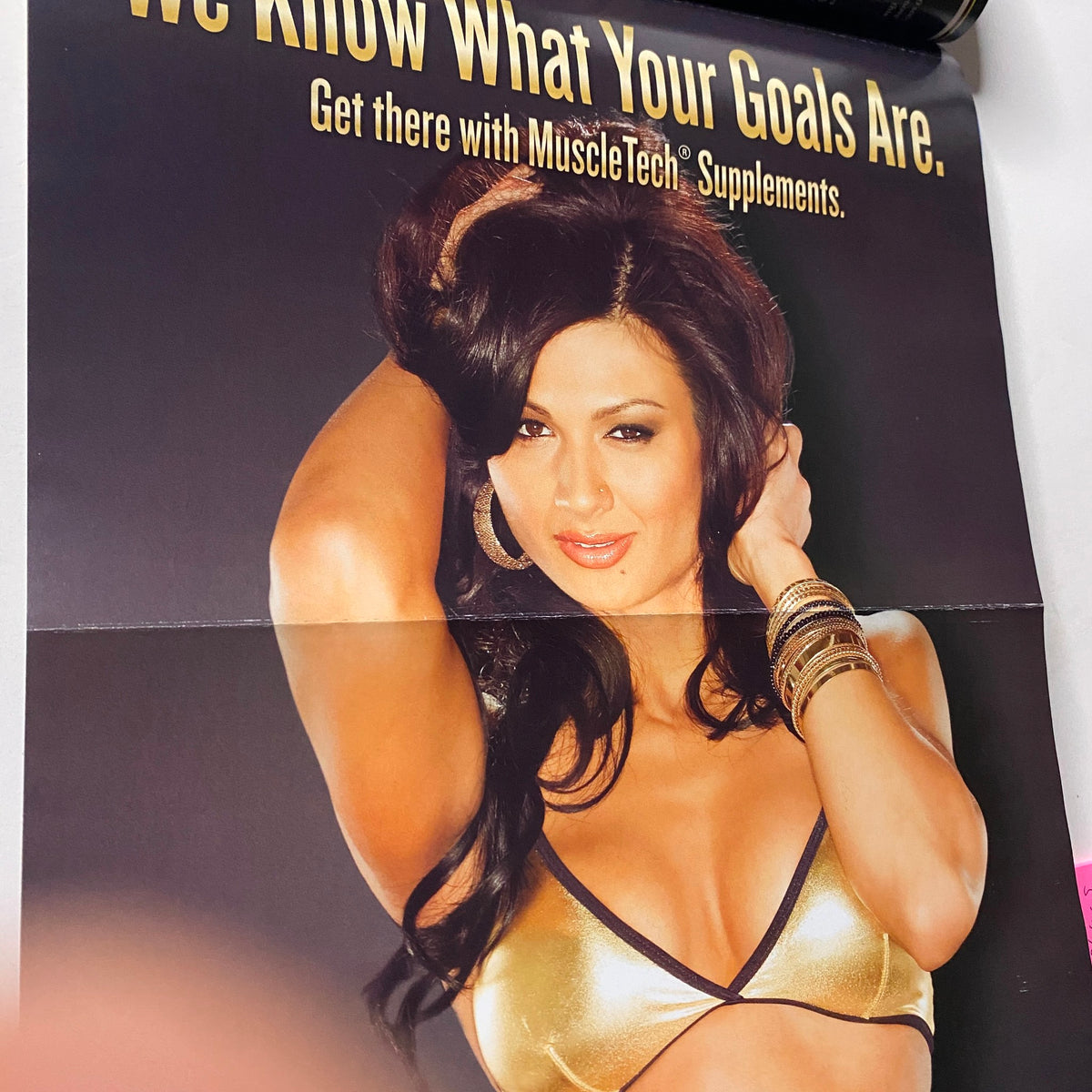 Ad showcasing a woman promoting MuscleTech supplements in MuscleMag International Magazine January 2011, No. 344.