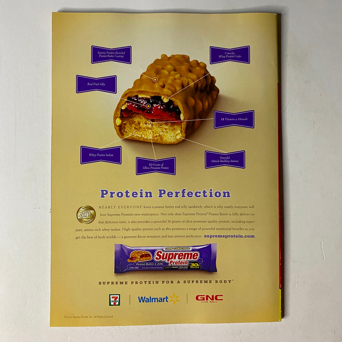 MuscleMag International Magazine Spring 2012 World's Best Workout ad for Supreme Protein bar with details on nutritional benefits and sales outlets including Walmart and GNC.