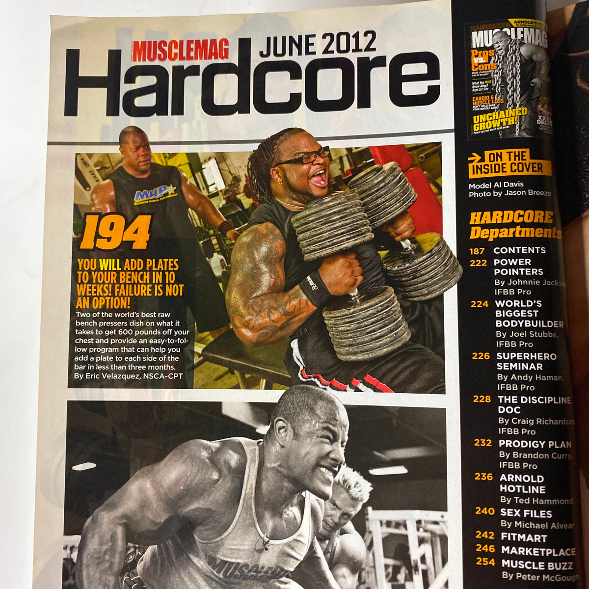 MuscleMag International Magazine June 2012 featuring hardcore bodybuilding training tips with an image of bodybuilders lifting weights and motivational text about adding plates to your bench. This issue includes a cover highlight on David Hoffman.
