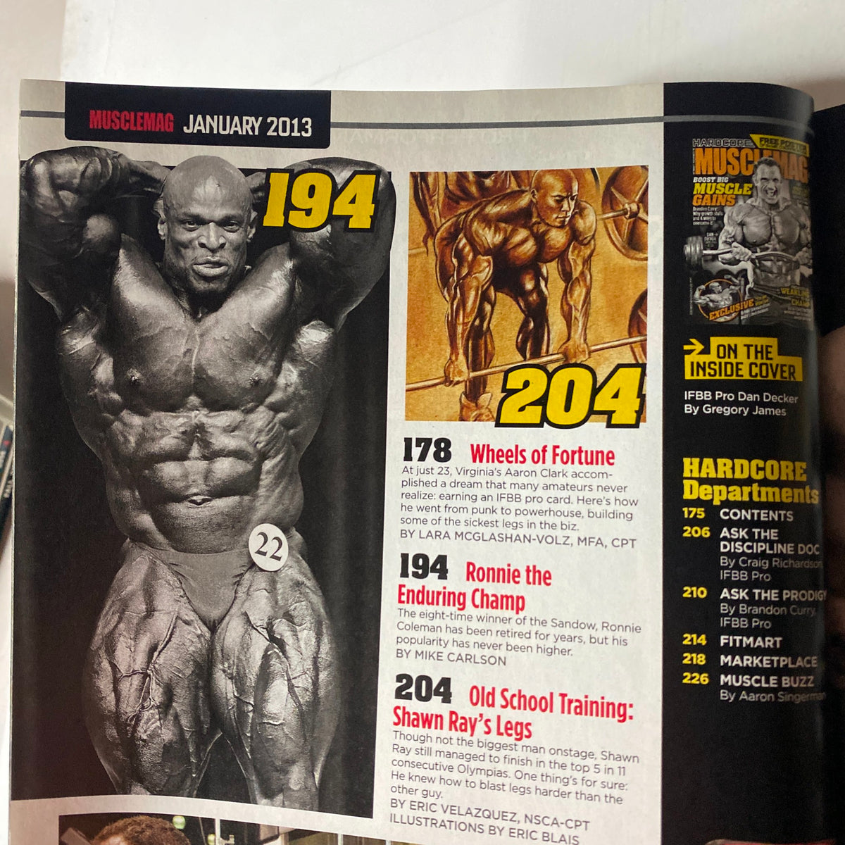 Interior page of MuscleMag International Magazine January 2013, featuring articles highlights including Ronnie Coleman in 'The Enduring Champ' and Shawn Ray's leg training, alongside other topics relevant to bodybuilding enthusiasts.