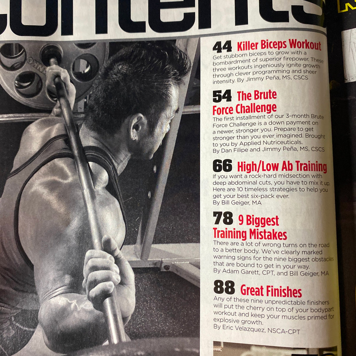 Contents page of MuscleMag International Magazine February 2014 highlighting sections including 'Killer Biceps Workout', 'The Brute Force Challenge', and 'High/Low Ab Training'.