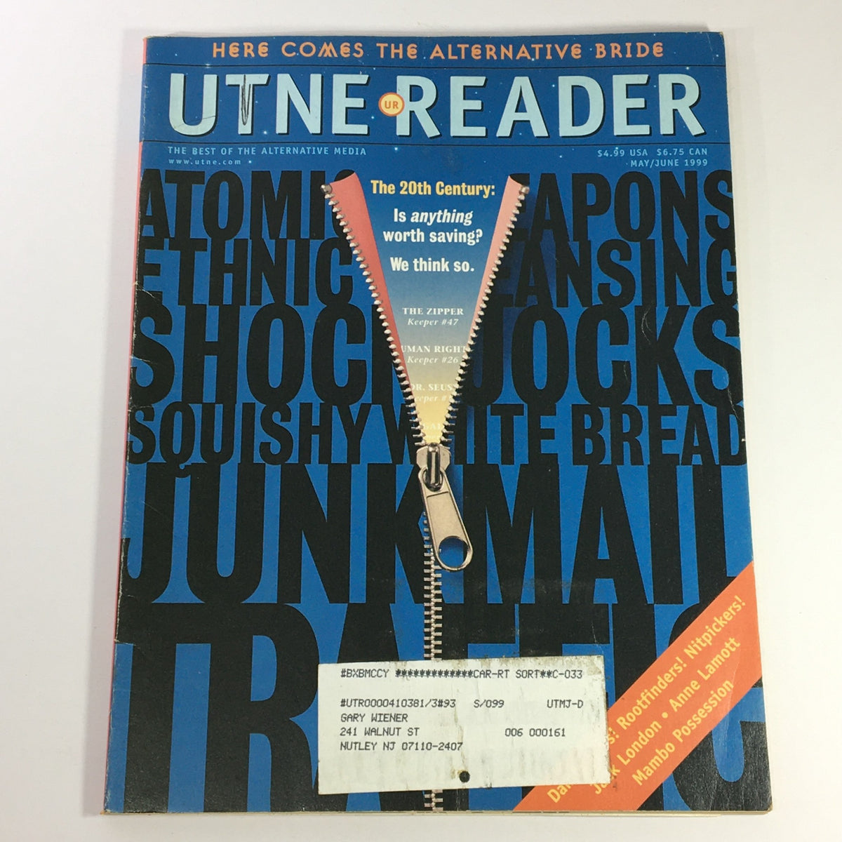 Cover of Utne Reader Magazine May June 1999, featuring a bold design with topics including atomic weapons, junk mail, and traffic, highlighted by a zipper graphic.