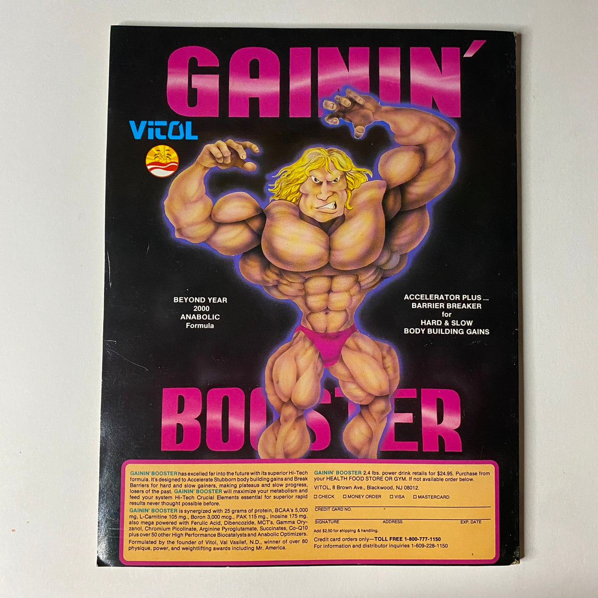 Back cover of Muscular Development Magazine April 1990 featuring an advertisement for Gainin' Booster supplement, emphasizing bodybuilding gains.