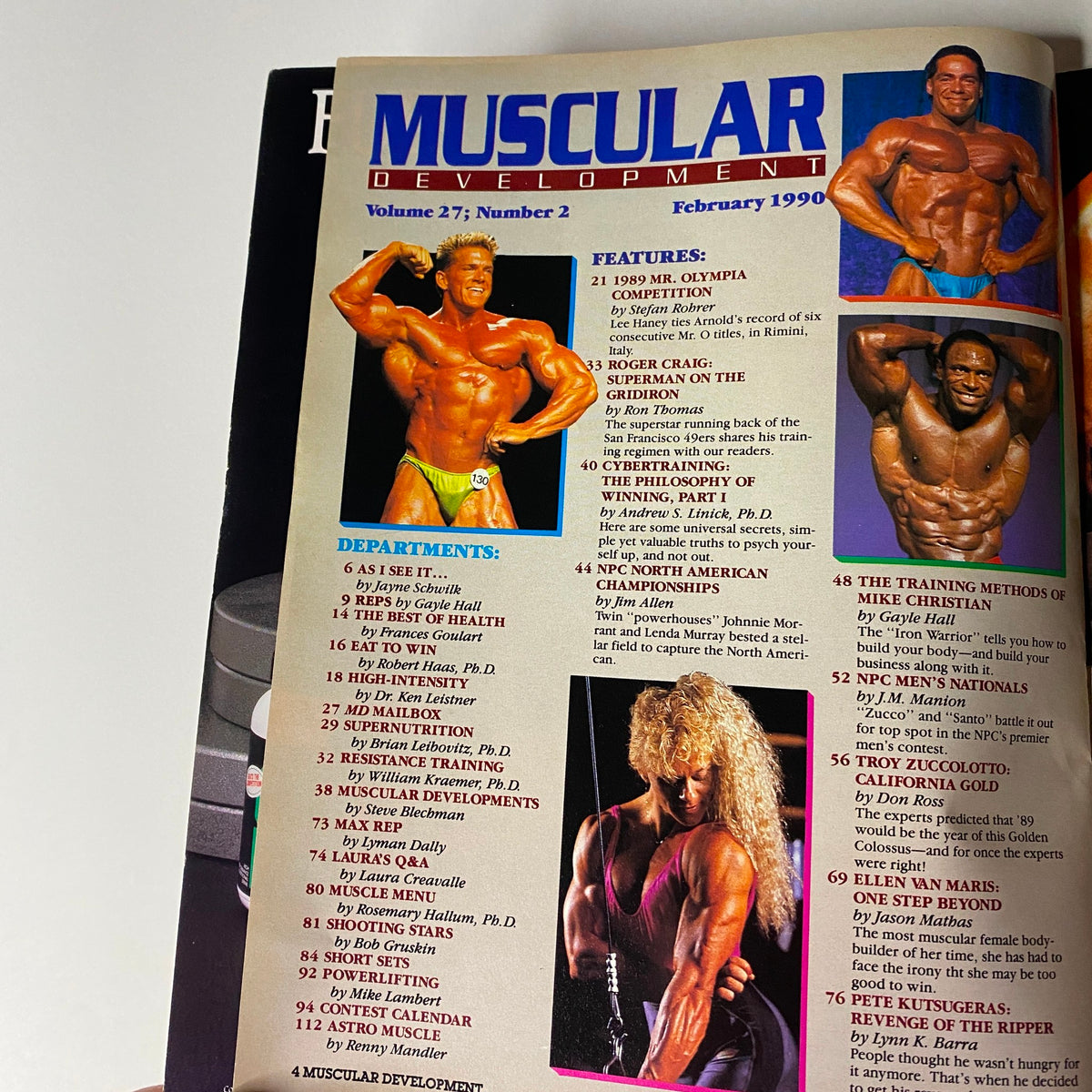 Inside page of Muscular Development Magazine February 1990 displaying the table of contents. Highlights include features on the 1989 Mr. Olympia competition and Roger Craig's training insights.