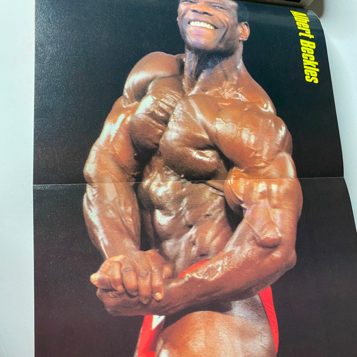 Centerfold poster from Muscular Development Magazine August 1991 showcasing a muscular bodybuilder posing. Highlighting peak fitness and strength.