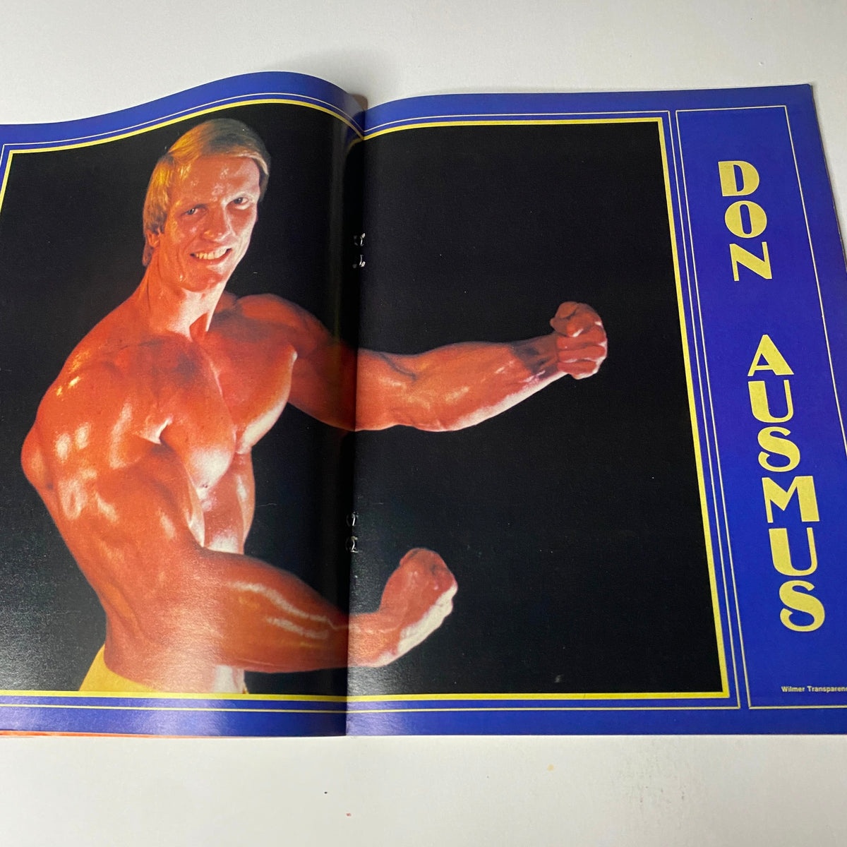 Muscular Development Magazine April 1983 featuring Donald Ausmus flexing in a centerfold, showcasing his impressive physique in vibrant color.