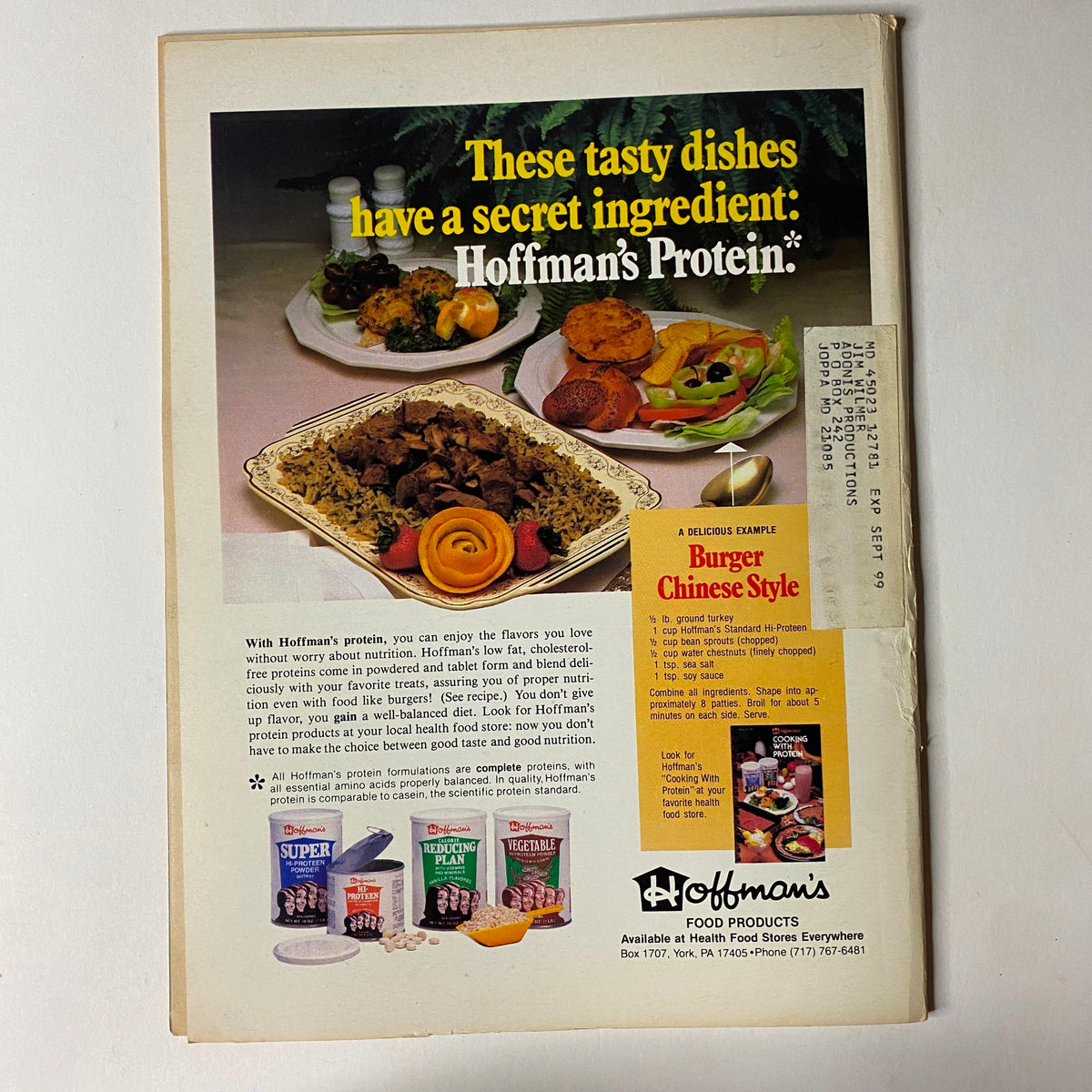 Vintage advertisement from Muscular Development Magazine June 1983 featuring Hoffman’s Protein products, showcasing a colorful meal with burger Chinese style and various protein options to promote health and nutrition.