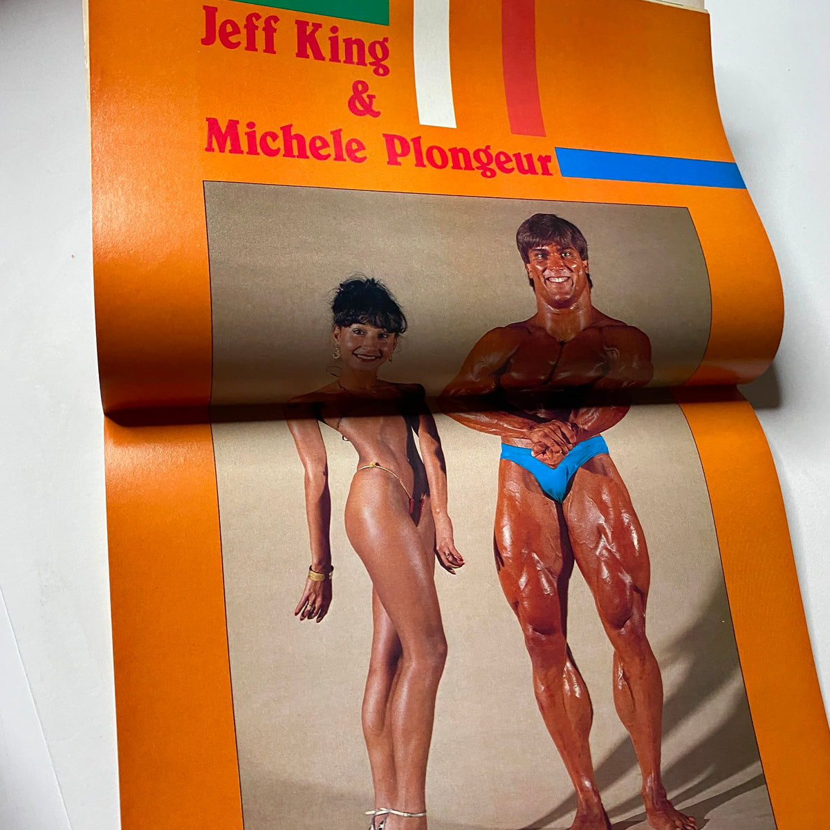 Centerfold from Muscular Development Magazine April 1985 featuring Jeff King alongside Michele Plongeur, displaying bodybuilding excellence.