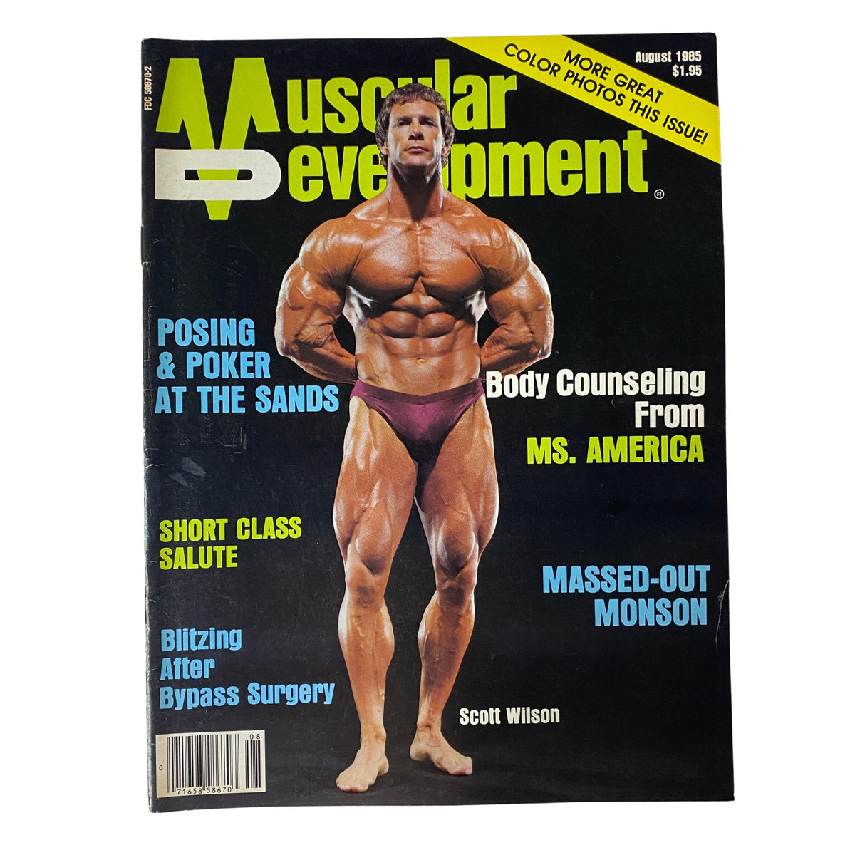 Muscular Development Magazine August 1985 featuring Scott Wilson on the cover. The magazine includes articles on bodybuilding, powerlifting news, and fitness tips. Good condition with a protective plastic sleeve.