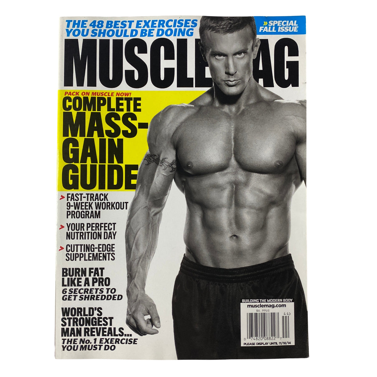 Cover of MuscleMag International Magazine Fall 2014 featuring a muscular man showcasing a complete mass-gain guide, emphasizing fast-track workout plans and nutritional insights.