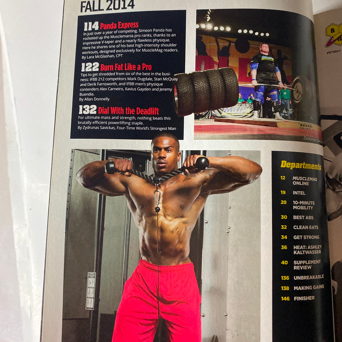 Interior page of MuscleMag International Magazine Fall 2014, highlighting articles on fat-loss techniques and deadlift methods, with a detailed image of a fit male athlete.