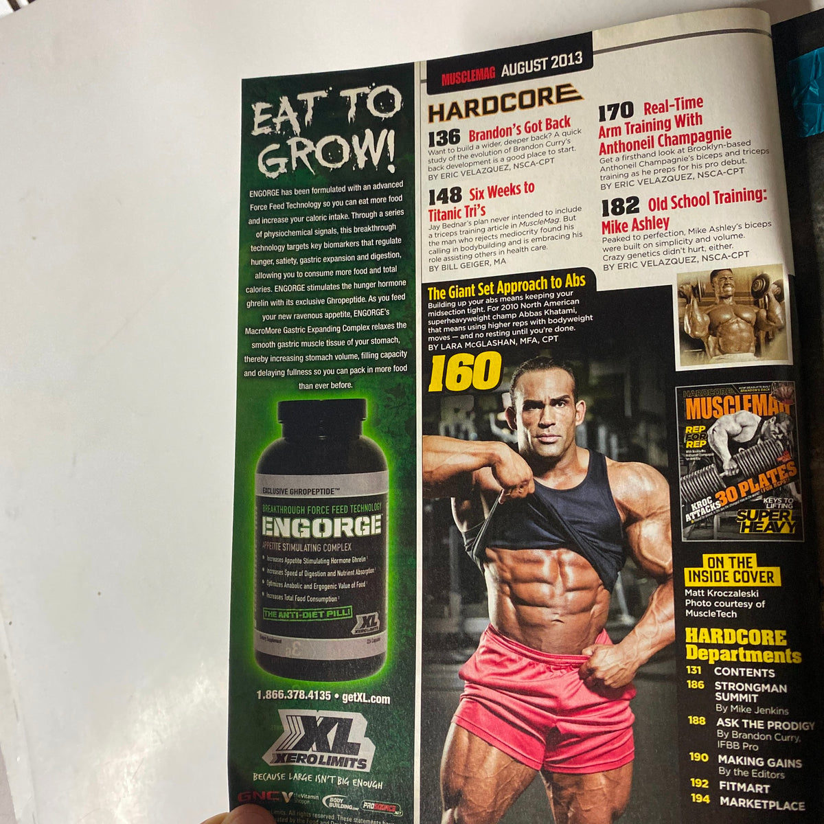 MuscleMag International Magazine August 2013 advertisement featuring nutrition supplement 'ENGORGE' aimed at bodybuilding enthusiasts, promoting muscle growth and exercise.
