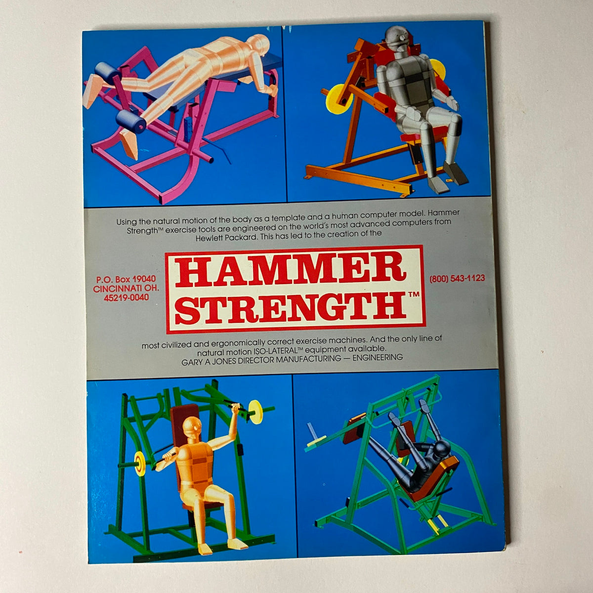 Muscular Development Magazine July 1990 showcasing training equipment with a graphic illustration of Hammer Strength machines and ergonomic models used for exercise, highlighting innovative fitness technology.
