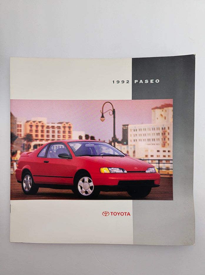 1992 Toyota Paseo Sports-Styled Subcompact Car Sale Catalog Brochure cover featuring a red Toyota Paseo on a cityscape background.