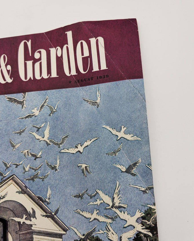 Close-up view of the top half of the House & Garden Magazine cover from August 1939, showcasing the title and illustration of doves in flight, part of the Lot of 2 House & Garden Magazine August 1939 House Portfolio.