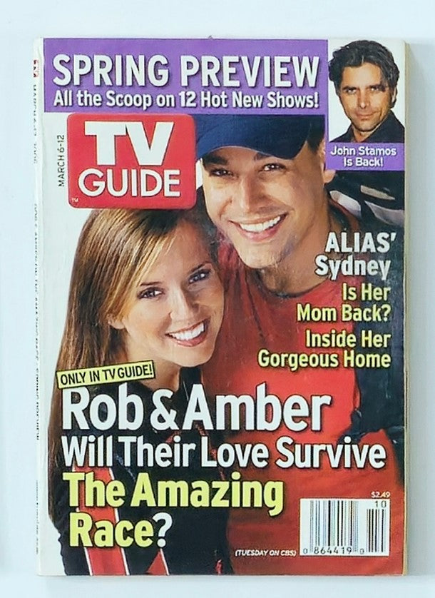 Cover of TV Guide Magazine March 6 2005 featuring Rob and Amber, detailing their story in reality TV, with a vibrant design and headlines highlighting the couple.