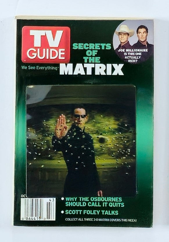 TV Guide Magazine from October 25, 2003 featuring Keanu Reeves on the cover, showcasing an iconic moment from The Matrix, highlighting celebrity interviews and television secrets.