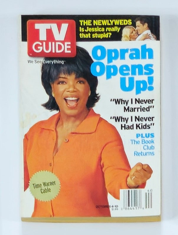 TV Guide Magazine October 4 2003 featuring Oprah Winfrey on the cover with the headline 'Oprah Opens Up!' highlighting her insights on personal topics such as marriage and motherhood.