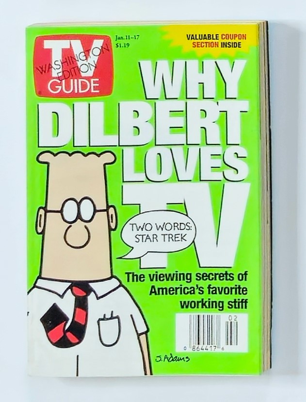 Cover of TV Guide Magazine dated January 11, 1997, featuring the title 'Why Dilbert Loves TV'. The image showcases the character Dilbert with a green background and highlights the text 'TWO WORDS: STAR TREK', emphasizing the humorous exploration of television viewing in the late 90s.