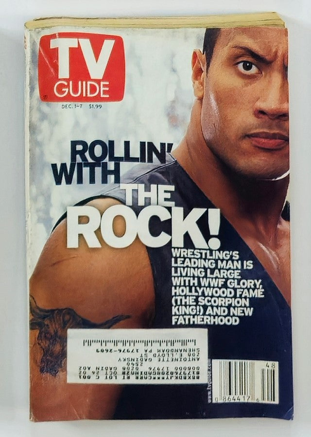 TV Guide Magazine December 1 2001 featuring Dwayne Johnson on the cover, showcasing the headline 'Rollin' with The Rock!' highlighting his career in wrestling and Hollywood.