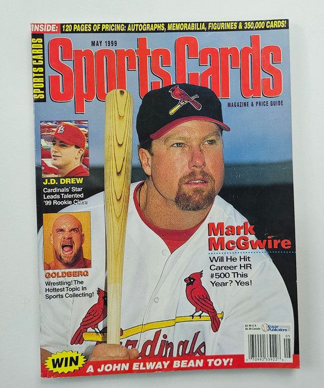 Sports Cards Magazine May 1999 featuring Mark McGwire, JD Drew, and Bill Goldberg on the cover, showcasing baseball and wrestling icons. The magazine highlights McGwire as he aims for his 500th career home run.
