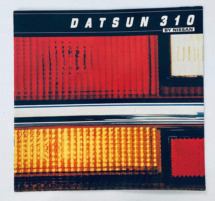Cover of the 1981 Nissan Datsun 310 Car Dealer Showroom Sales Brochure featuring a close-up of the car's tail lights with vibrant red and orange colors.