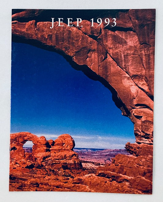 1993 Jeep Dealer Showroom Sales Brochure featuring a stunning view of natural rock formations with a vibrant blue sky background, showcasing the adventurous spirit of the Jeep brand.