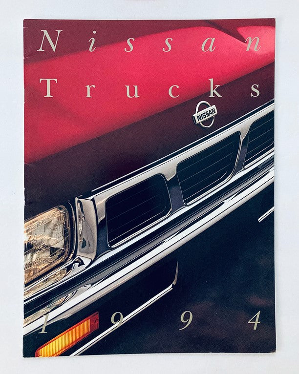Cover of the 1994 Nissan Trucks Dealer Showroom Sales Brochure Guide Catalog showcasing the front grille and headlights of a Nissan truck.