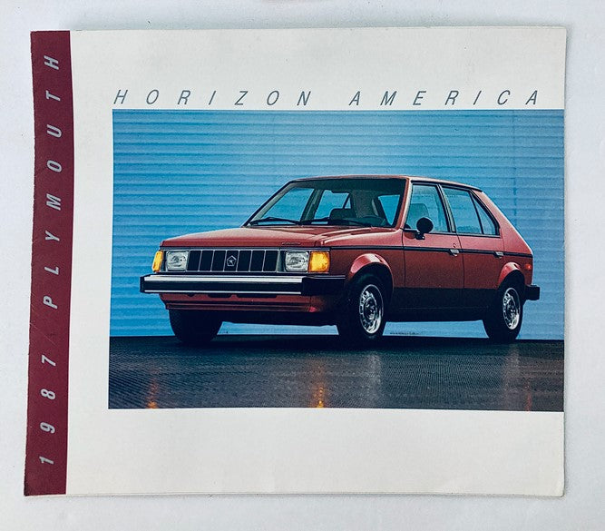 1987 Plymouth Horizon America Car Dealer Showroom Sales Brochure featuring a red Plymouth Horizon America model displayed against a blue background.