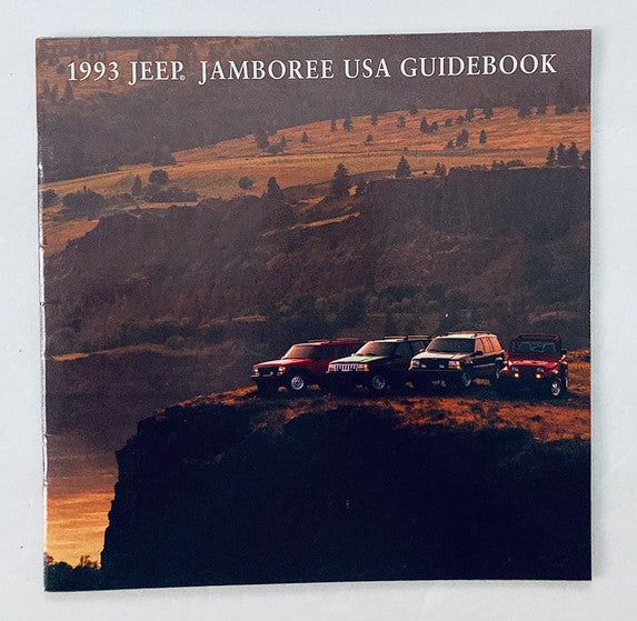 1993 Jeep The Jamboree USA Guidebook featuring a scenic landscape with multiple Jeep vehicles parked on a cliff at sunset, showcasing the adventurous spirit of off-roading.