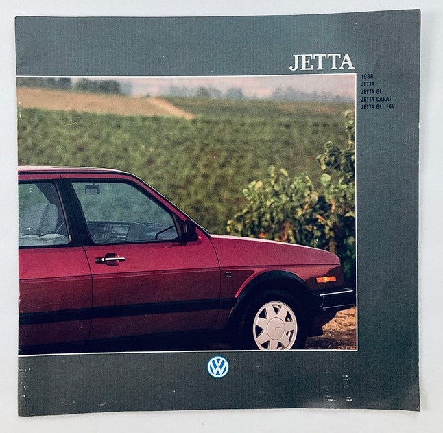 1988 Volkswagen Jetta Dealer Showroom Sales Brochure featuring a side view of a maroon Jetta parked near a vineyard landscape.