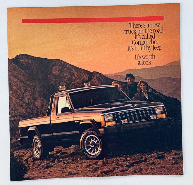 1986 Jeep Comanche Dealer Showroom Sales Brochure featuring a Jeep Comanche truck on a scenic mountain backdrop with a couple standing beside it, highlighting its rugged design and appeal.