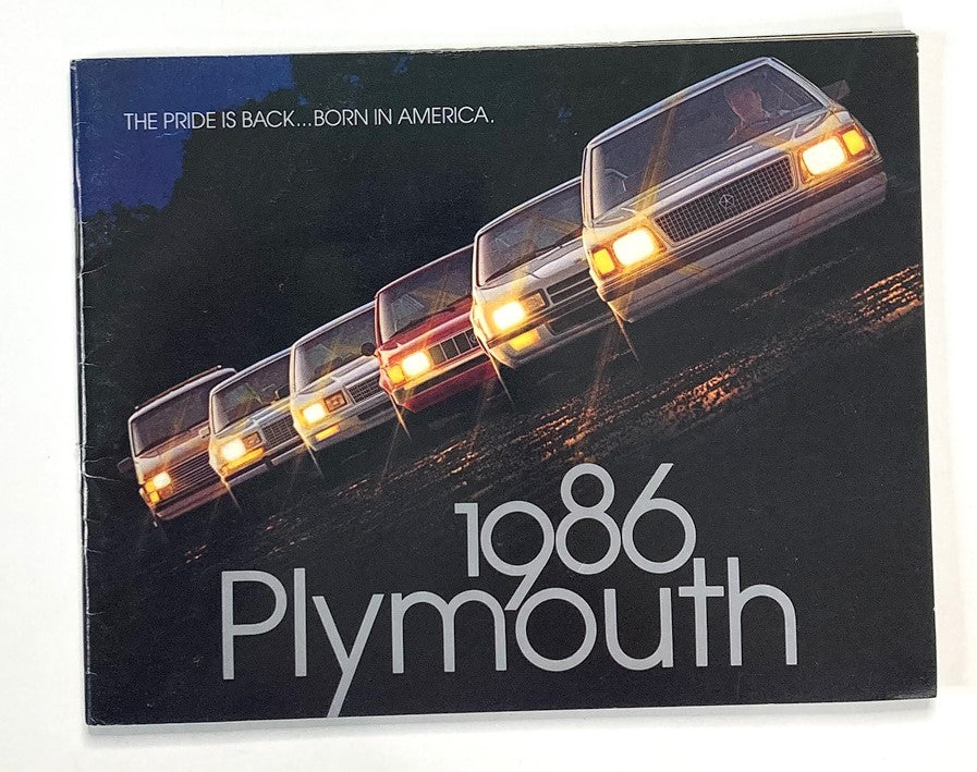 1986 Plymouth Dealer Showroom Sales Brochure Guide Catalog featuring a lineup of vintage Plymouth cars with the slogan 'THE PRIDE IS BACK...BORN IN AMERICA'