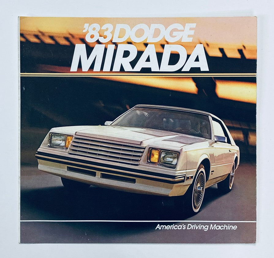 1983 Dodge Mirada Dealer Showroom Sales Brochure Guide Catalog featuring a front view of the classic car against an urban backdrop, highlighting its sleek design and American automotive heritage.