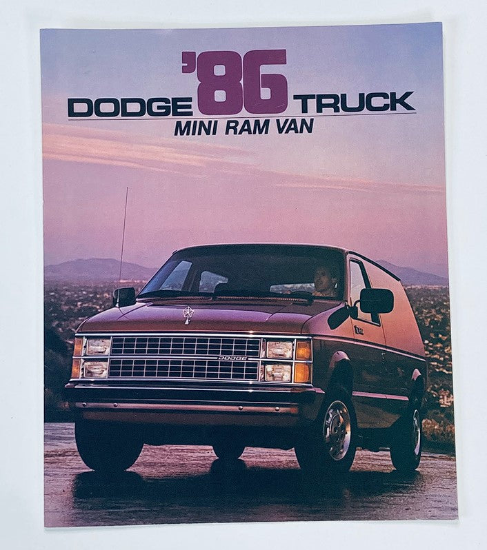 1986 Dodge Truck Mini Ram Van Sales Brochure showcasing the vehicle against a scenic background, highlighting its vintage design and features.