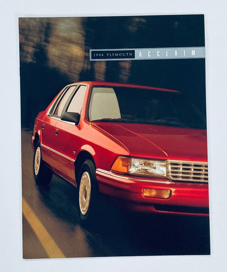 1994 Plymouth Acclaim Dealer Showroom Sales Brochure featuring a red Plymouth Acclaim on a scenic road, showcasing the design of this mid-size sedan.
