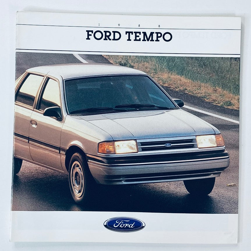 1988 Ford Tempo Dealer Showroom Sales Brochure Guide Catalog featuring a silver Ford Tempo parked on a scenic road.