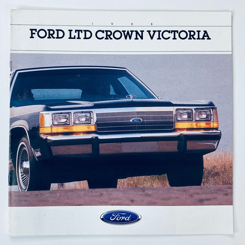 Cover of the 1988 Ford LTD Crown Victoria Dealer Showroom Sales Brochure, featuring a front view of the iconic black Ford LTD Crown Victoria car with a scenic background.