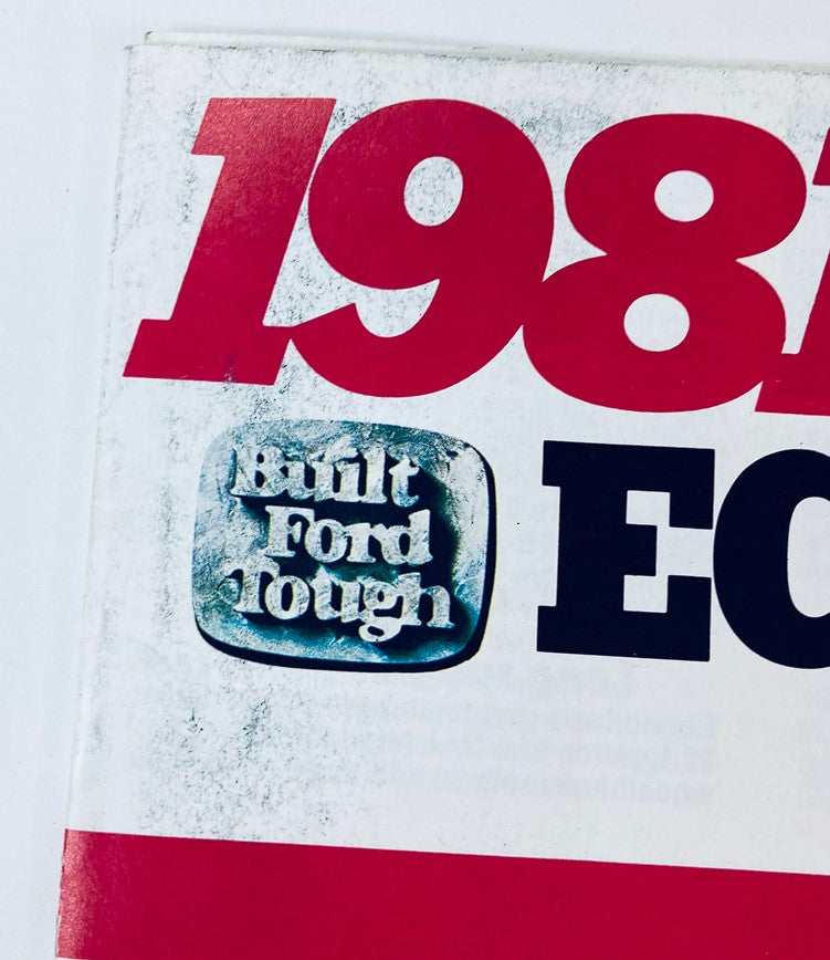 Close-up of the 1981 Ford Econoline Dealer Showroom Sales Brochure displaying the 'Built Ford Tough' emblem, emphasizing the brand's commitment to durability and strength.