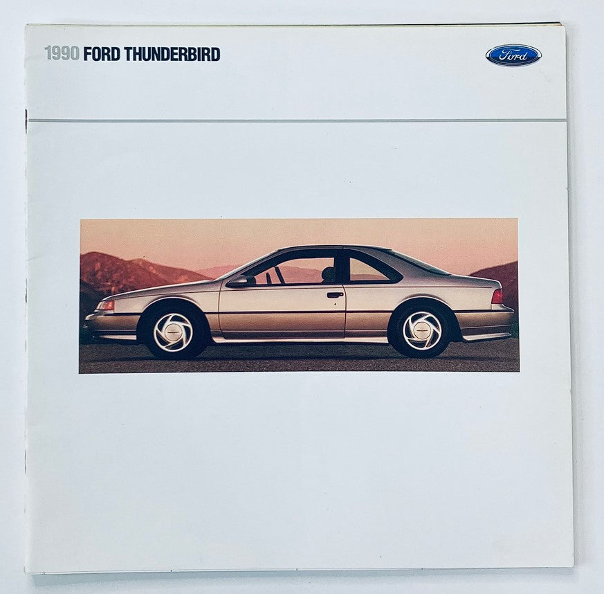 1990 Ford Thunderbird Dealer Showroom Sales Brochure showcasing a side view of the silver 1990 Ford Thunderbird against a mountainous backdrop.
