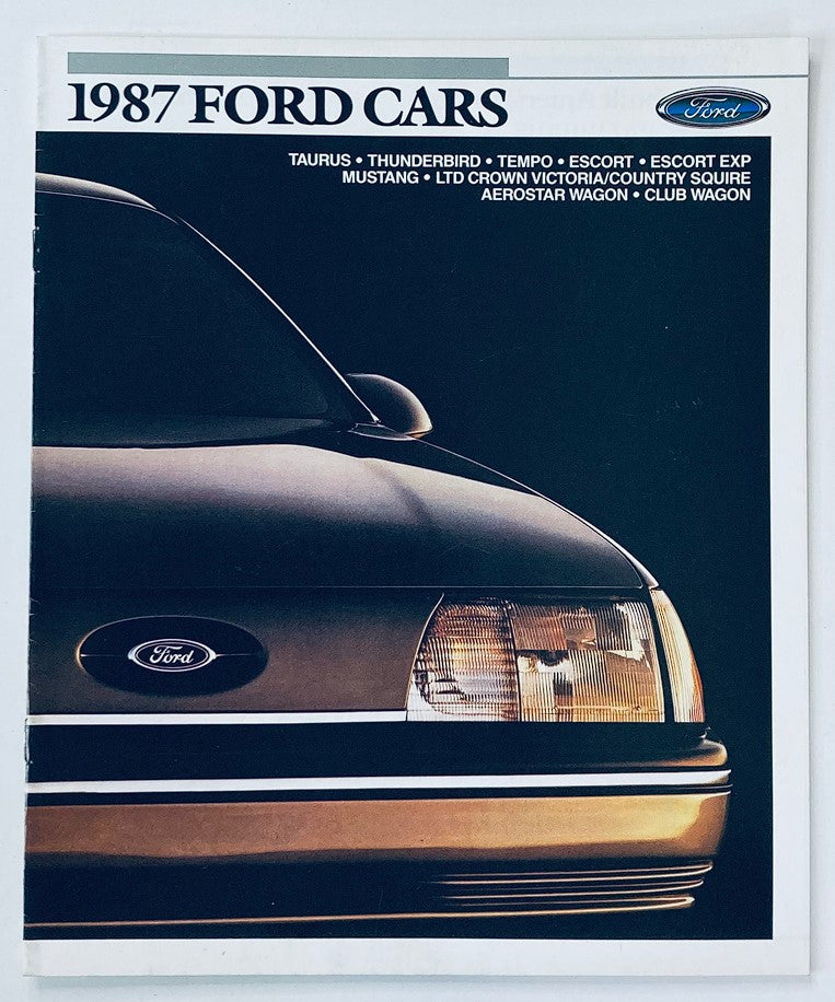 1987 Ford Cars brochure featuring Taurus, Thunderbird, Tempo, Escort, Mustang, and more, showcasing a close-up view of a Ford vehicle's front end.