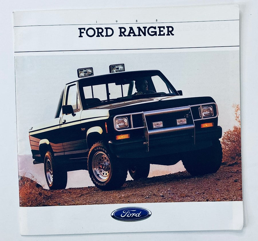 1988 Ford Ranger Dealer Showroom Sales Brochure Cover featuring a classic black Ford Ranger truck parked on a rocky terrain, showcasing the truck's design and style.