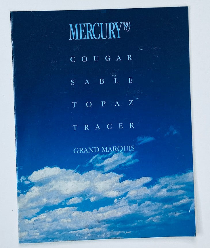 1989 Mercury Cougar, Sable Dealer Showroom Sales Brochure, featuring a blue sky background with clouds, showcasing the model lineup including Cougar, Sable, Topaz, Tracer, and Grand Marquis.