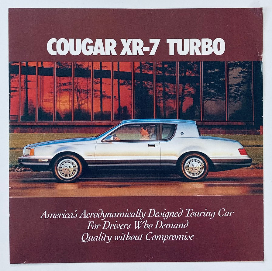 1984 Mercury Cougar XR7 Turbo dealer showroom sales brochure cover featuring the car in front of a building, highlighting its aerodynamic design and appeal to drivers seeking quality.