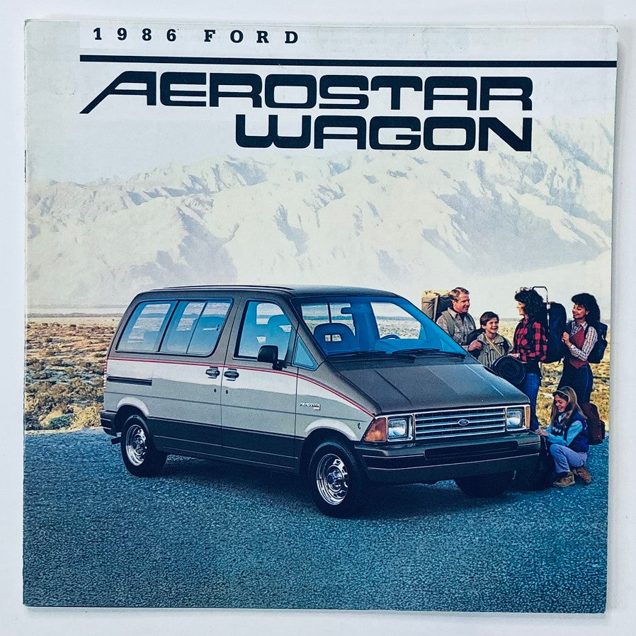 Cover of the 1986 Ford Aerostar Wagon Dealer Showroom Sales Brochure Guide Catalog, featuring a Ford Aerostar Wagon with a scenic mountainous background and people gathered around it.
