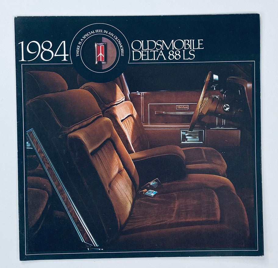 Cover of the 1984 Oldsmobile Delta 88 LS Dealer Showroom Sales Brochure, showcasing the luxurious interior with plush seating.