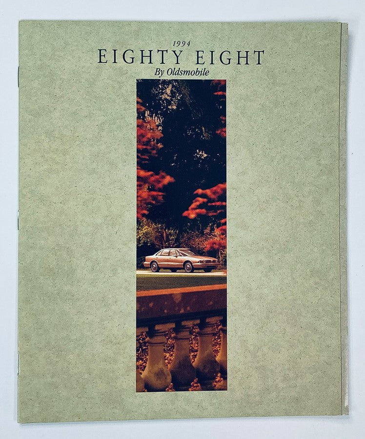 1994 Oldsmobile Eighty Eight Dealer Showroom Sales Brochure Guide Catalog cover featuring a scenic image of the Oldsmobile Eighty Eight car in a vibrant outdoor setting.