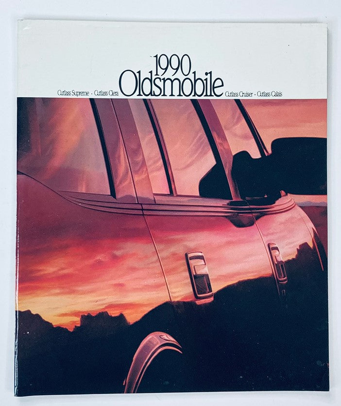 Cover of the 1990 Oldsmobile Cutlass Supreme Sales Brochure Guide Catalog featuring a close-up image of the vehicle's rear silhouette against a colorful sunset backdrop.